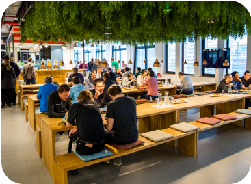 Employees eating at a Cloud Cafe Cafeteria
