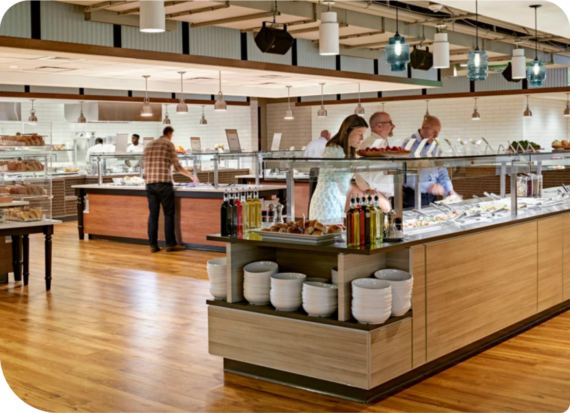 Employees at a corporate cafeteria grabbing lunch