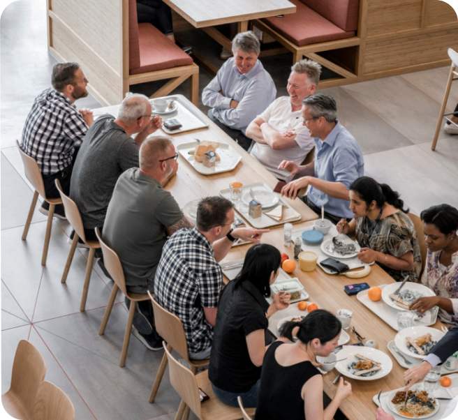 Employees eating at a cafeteria Employees eating at a cafeteria
