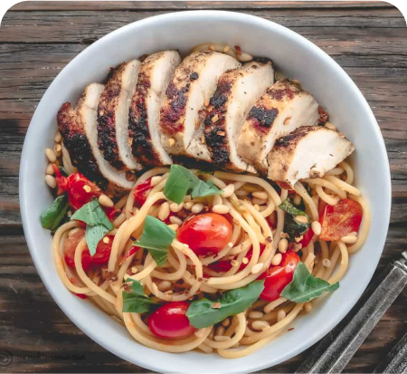 Chicken, veggies, and noodles in a bowl Chicken, veggies, and noodles in a bowl