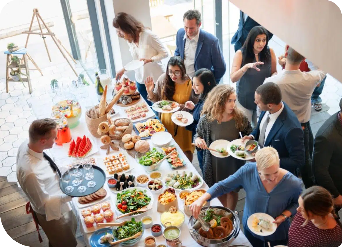 Employees eating catering food at a business event