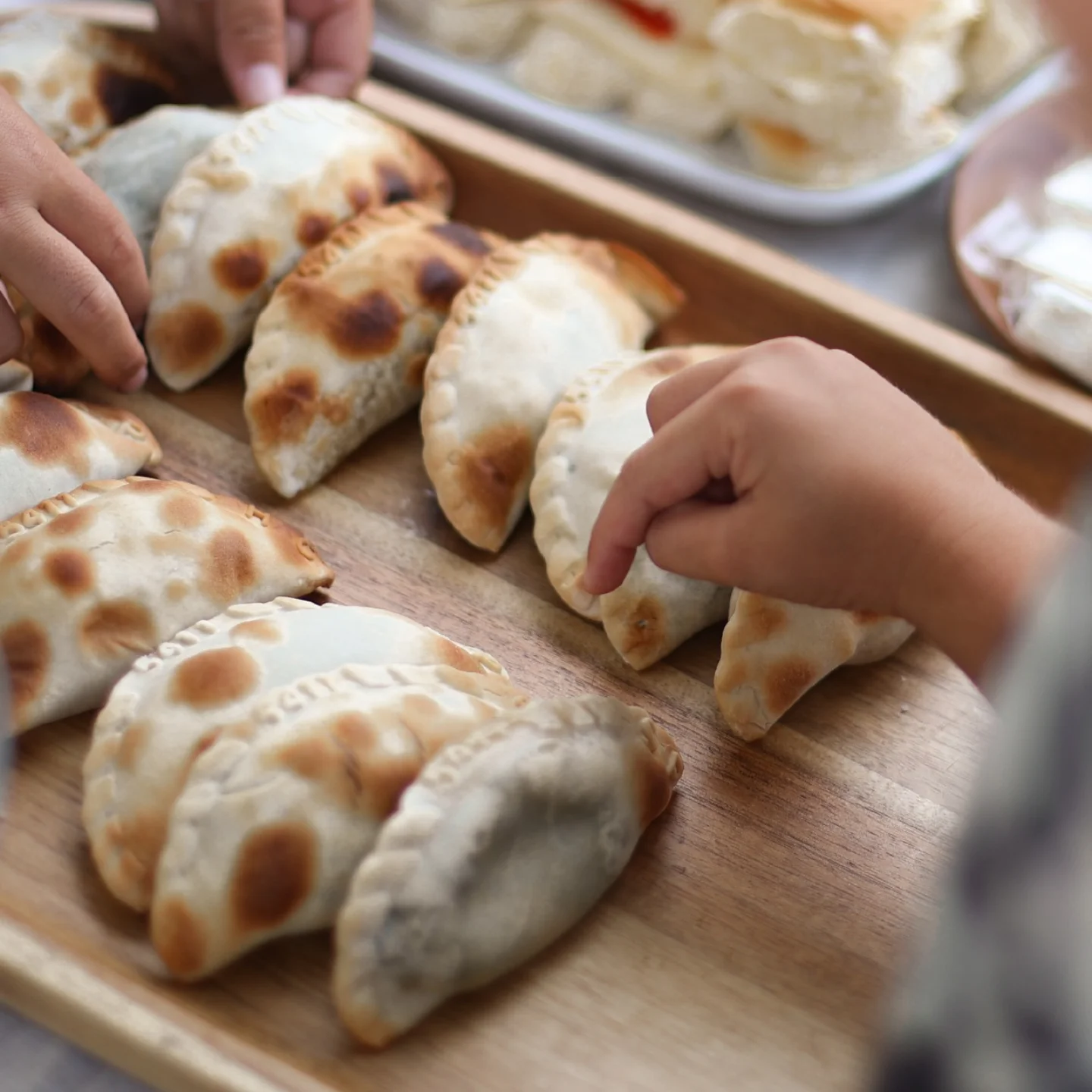 5411 Empanadas catering tray with golden baked empanadas and dipping sauces