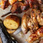 Corporate event catering spread with grilled meats, sides, and sauces in Los Angeles