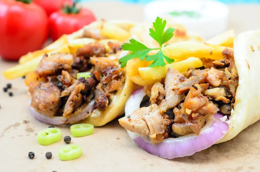 Portillo's catering spread with Chicago-style hot dogs, Italian beef sandwiches, and sides