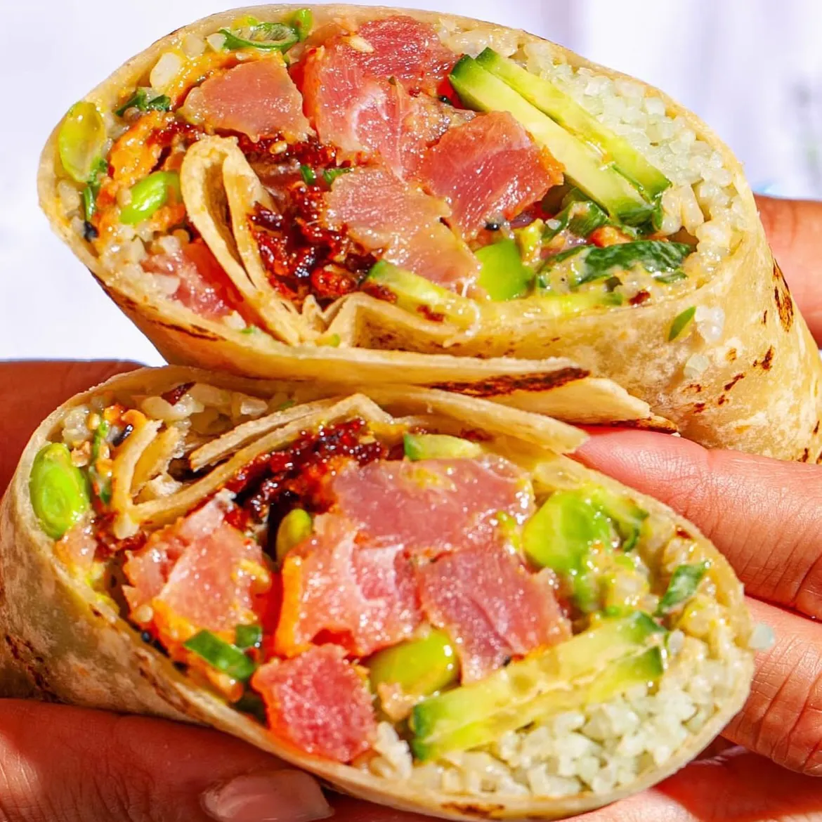Sweetfin poke bowl with fresh fish, avocado, and sesame toppings