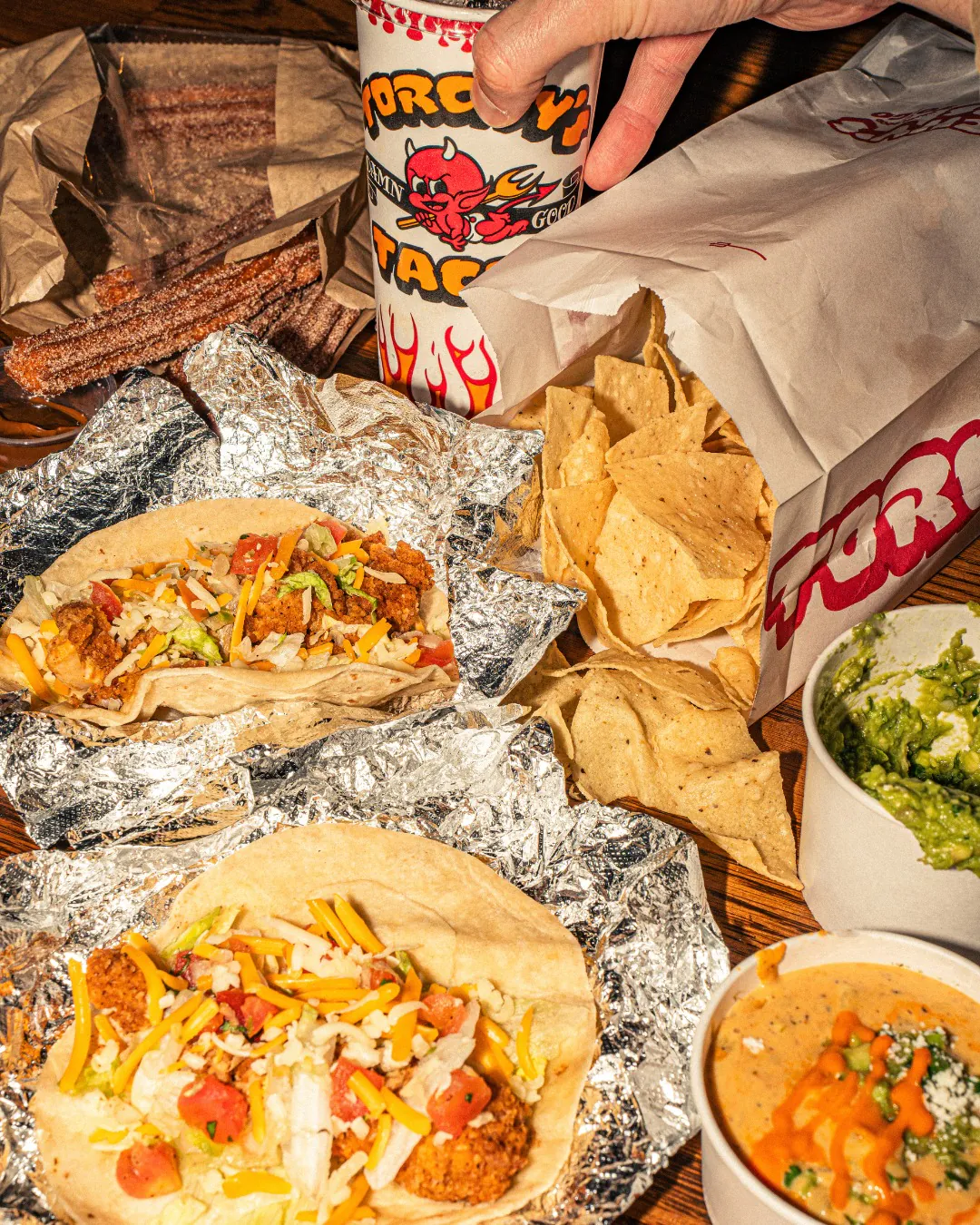 Torchy's Tacos catering spread with tacos and queso for a corporate event