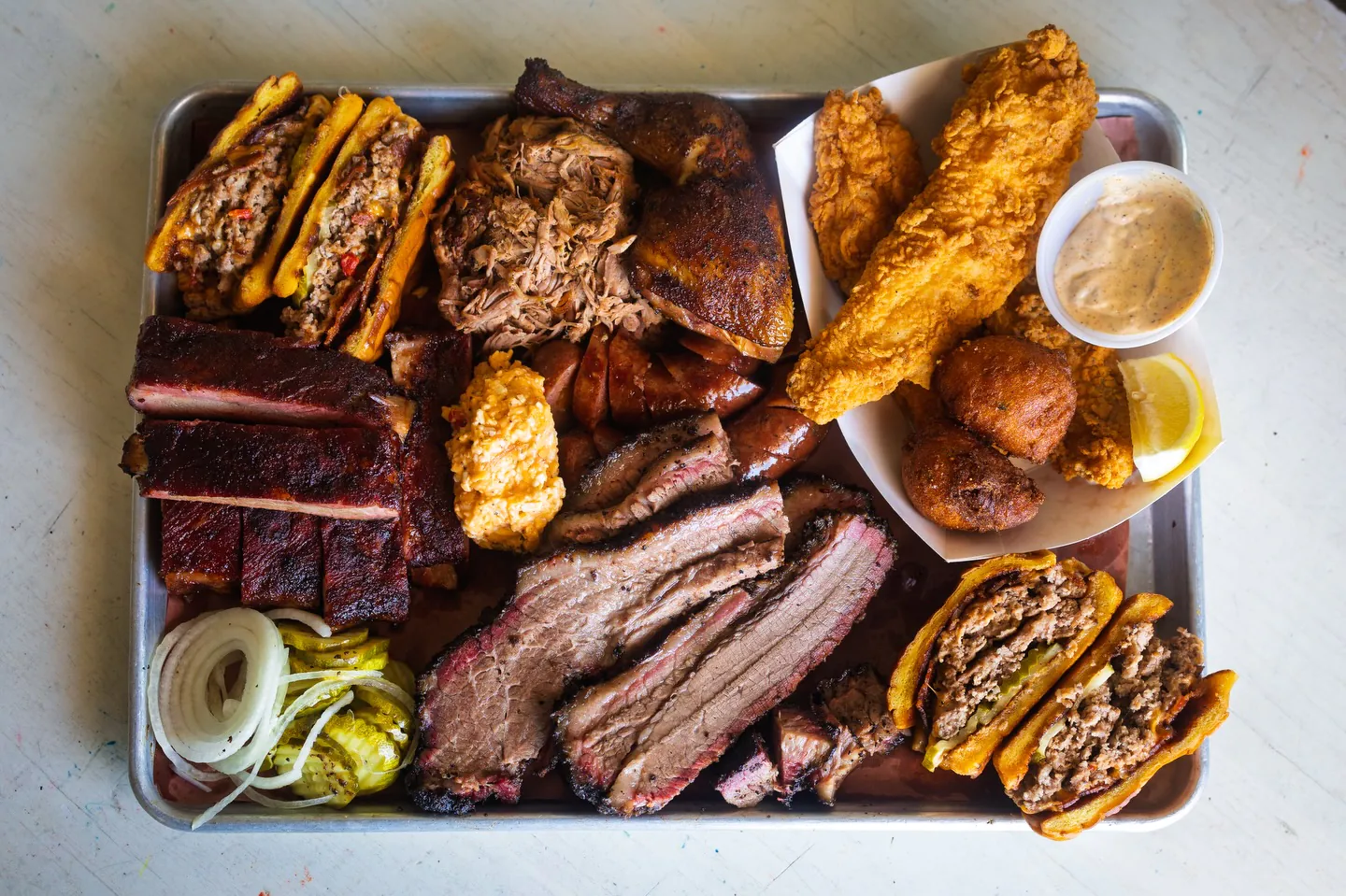 Fox Bros. Bar-B-Q Texas-style brisket and sides catering spread for an Atlanta event