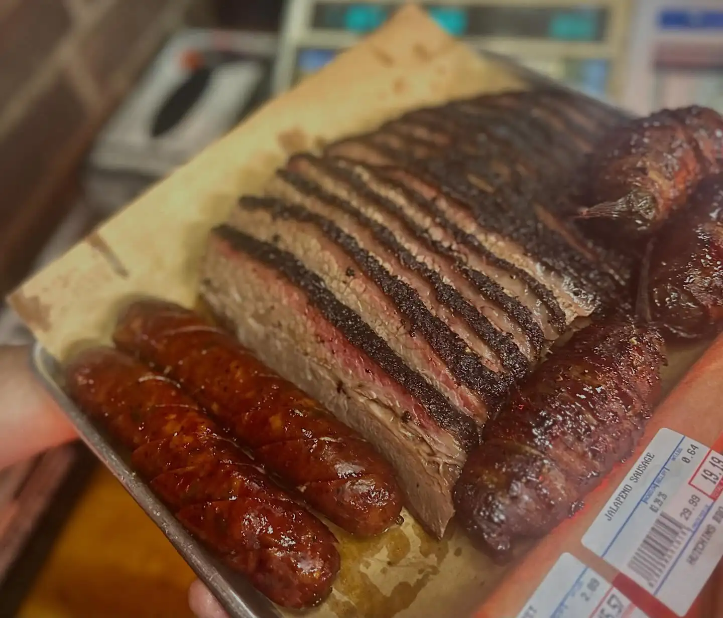 Hutchins BBQ smoked meats and sides catering spread for a Frisco corporate event