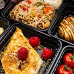 Boxed lunch catering meals in individual containers showing variety of office catering options