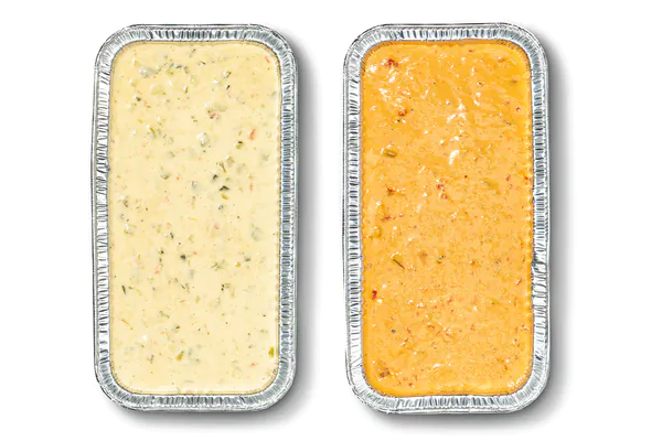 QDOBA 3-Cheese Queso and Queso Diablo catering pans side by side, both served in foil catering trays