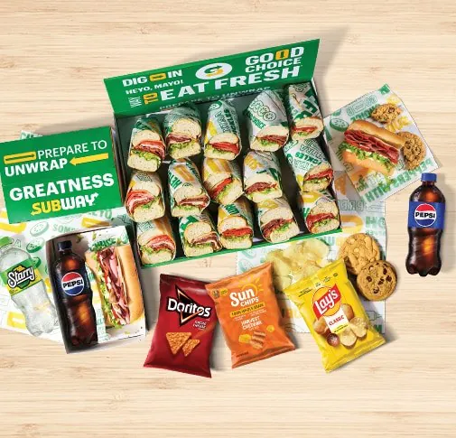 Subway catering sandwich platter box with subs, chips, and cookies
