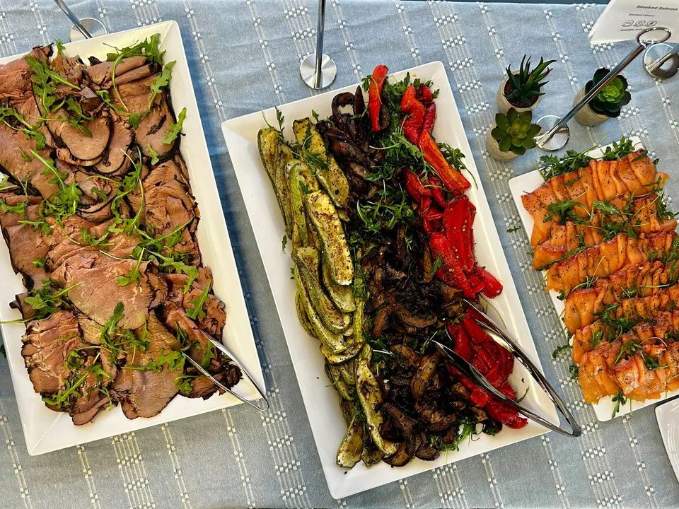 Elegant platters of sliced roast beef, grilled vegetables, and smoked salmon for a premium Denver corporate event