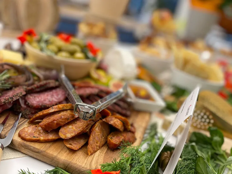 Italian charcuterie board with sliced sausage, salami, olives, and fresh herbs for a premium Philadelphia corporate event