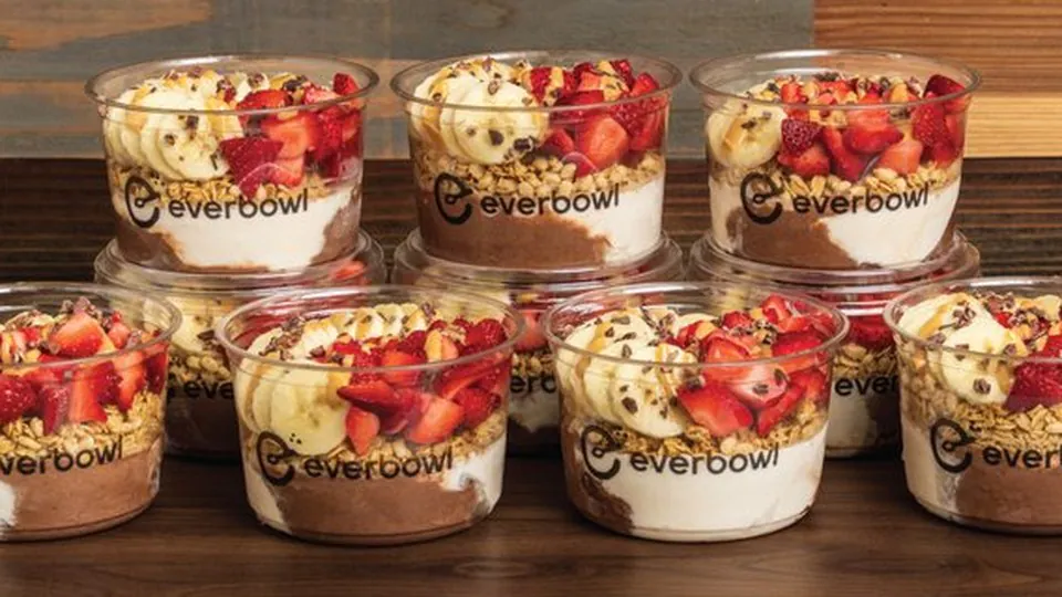 A catering pack of Everbowl signature superfood bowls arranged in rows for an office order