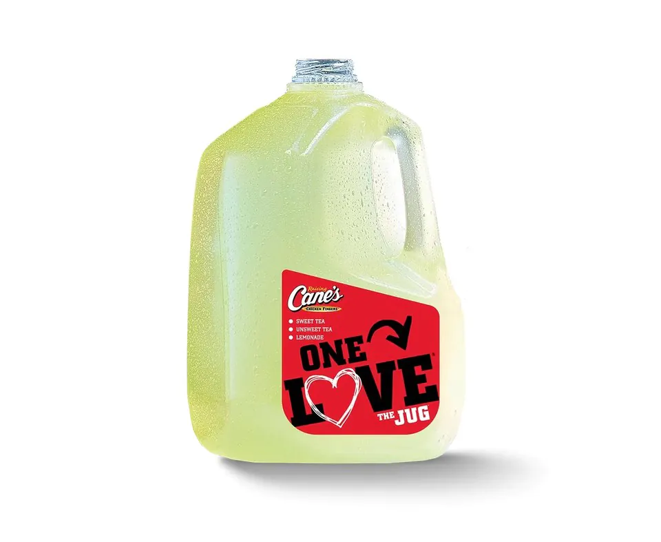 A chilled gallon jug of Raising Cane's lemonade with a red ONE LOVE label listing sweet tea, unsweet tea and lemonade