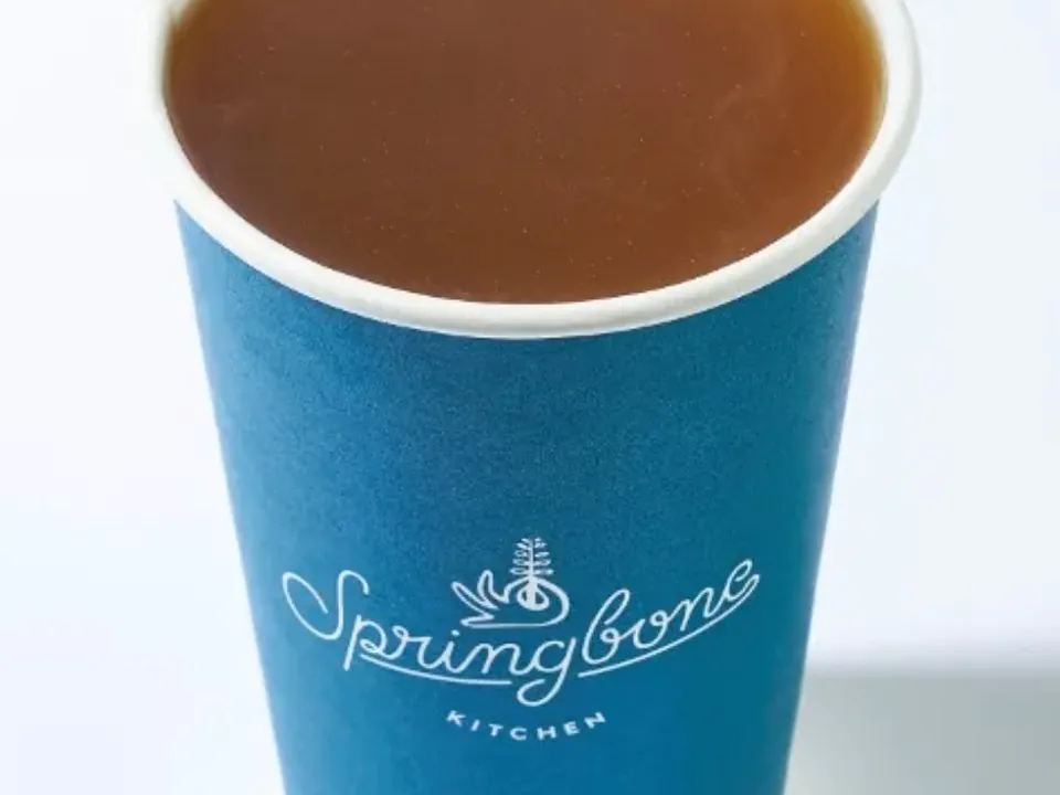 Springbone Kitchen branded cup filled with bonebroth