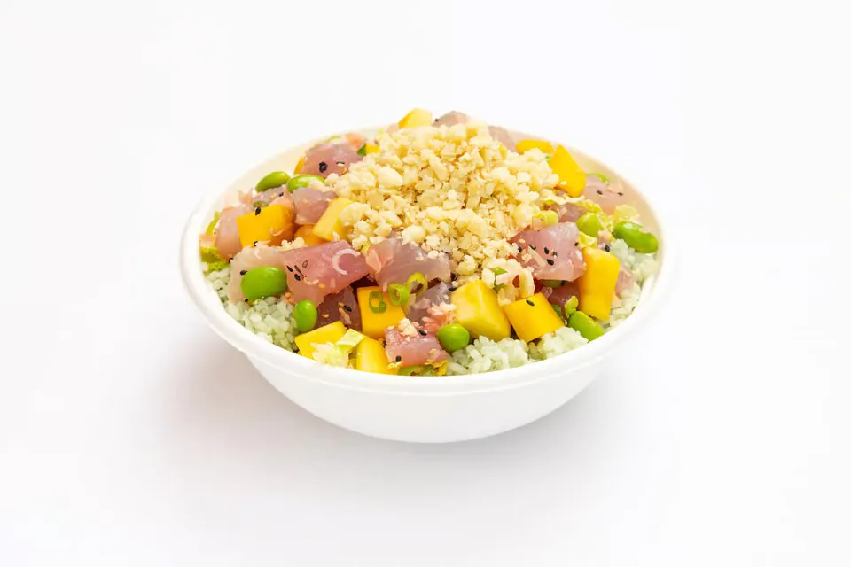 Sweetfin mango albacore poke bowl with edamame, mango and macadamia nuts over bamboo rice
